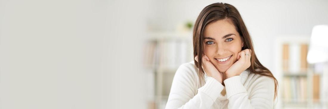 Woman smiling at cosmetic dentist office in Springfield MO