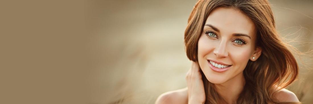 Woman smiling wearing dental implants in Springfield MO